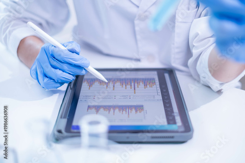 Woman scientist person research writing document science study datum in modern laboratory, professional female doctor working on medical test lab note report health technology development analysis