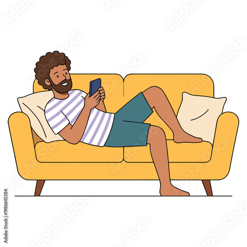 Man relaxing on yellow couch with pillow reading phone