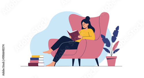 Young woman enjoys reading a book while sitting in a large pink armchair with a stack of books and a potted plant nearby at home.