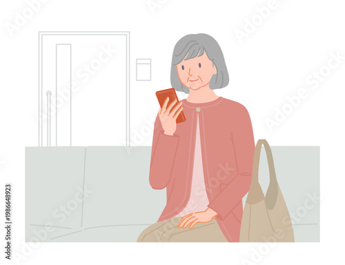 Senior woman using smartphone while waiting in hospital waiting room