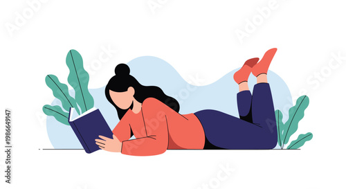 Young woman relaxing while lying on the floor and reading an interesting book in a peaceful environment with green plants.