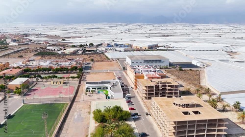urban drone roof building project unfinished industry greenhouse plastic sea invernaderos industrial city town intensive farming agriculture town - Andalusia, Spain - 2025