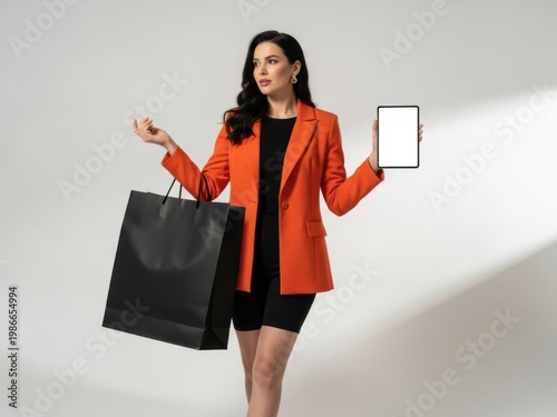 Woman holding shopping bag and tablet isolated on white background isolated on white background
