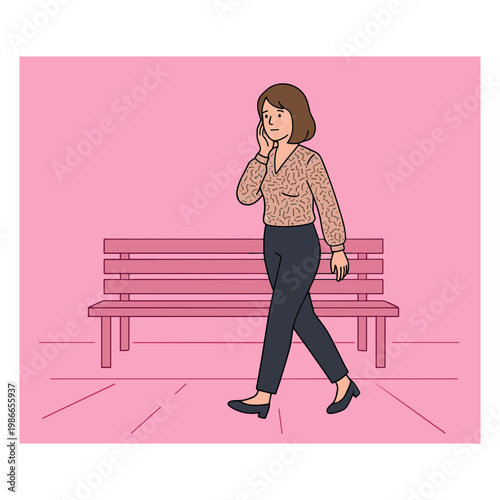 Woman walks alone on sidewalk talking on phone near bench