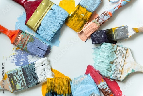 Фотография Colorful paintbrushes arranged in circle