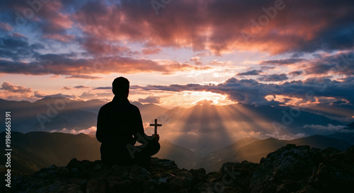 silhouette of a man in meditation in the mountains at sunrise.