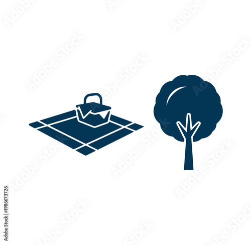 picnic basket and tree in park for outdoor activities and relaxation in nature