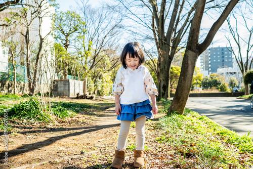 Close-up Portrait of a Happy Little Japanese Girl Outdoors in Winter
