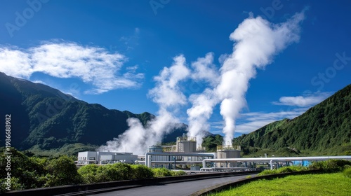 Industrial Power Plant with Steam Emission Against Blue Sky