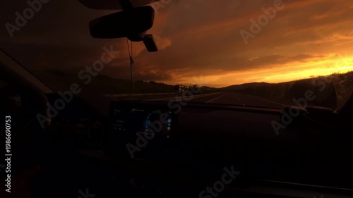 View of Beautiful Golden Sunset Horizon from Inside Dark Room