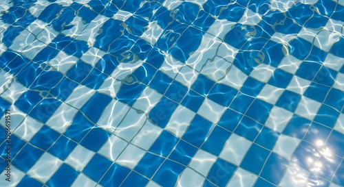 Blue swimming pool water, tiled surface, ripples and reflections, summer background
