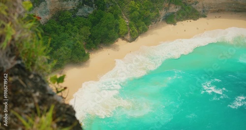 Stunning aerial perspective of turquoise ocean water meeting white sand tropical beach