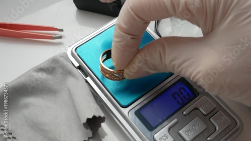 Gemologist jeweler evaluates the value and purity of yellow stones at a pawn shop.