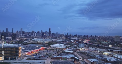  Aerial Night Panorama of Downtown Chicago Skyline Under Dramatic Overcast Sky – Cinematic Urban Cityscape” on April 15 2026 