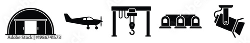 Collection of black glyph icons representing industrial and aviation infrastructure including hangar, airplane, gantry crane, security cameras, and spotlight for various design projects