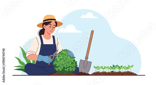 Female gardener wearing a straw hat and overalls prunes a bush while sitting on the ground in a sunny vegetable garden.