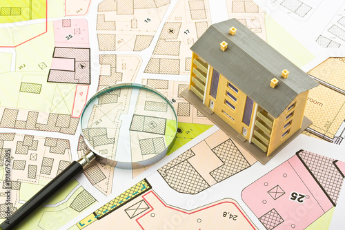 Imaginary cadastral map and general urban plan with cadastral parcels, urban destinations, vacant land plots and condominium residential building