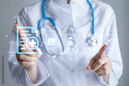 Fotografija Health professional using technology to access medical information and manage pa