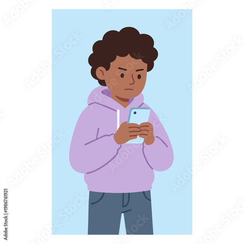 A young boy looks at his phone with a concerned expression indoors.