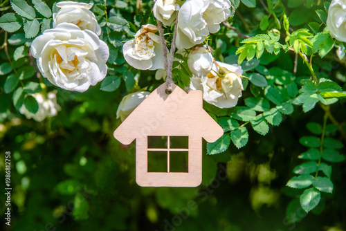 Wallpaper Mural The symbol of the house among the branches of the white rose
 Torontodigital.ca