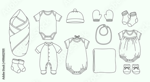 Baby clothes and accessories laid out.