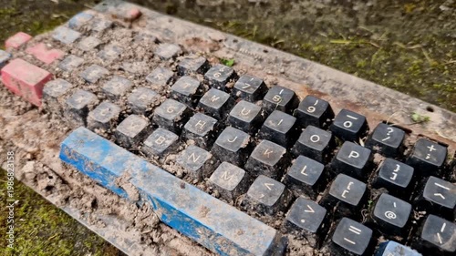 weathered, mechanical keyboard being overtaken by moss and soil. aesthetic solarpunk, clean it, do not plug it in. Powering up damp or corroded board will cause short circuit permanently fry rare chip