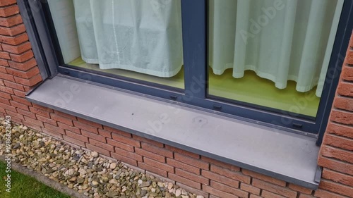 detail modern aluminum window frame with exterior sill. Aluminum profiles,low weight and high resistance to corrosion. exterior blinds window blinds, installed on facade opening to regulate heat light