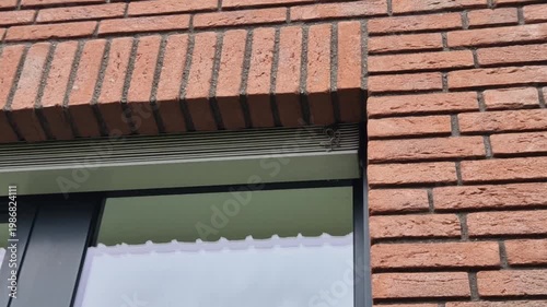 detail modern aluminum window frame with exterior sill. Aluminum profiles,low weight and high resistance to corrosion. exterior blinds window blinds, installed on facade opening to regulate heat light
