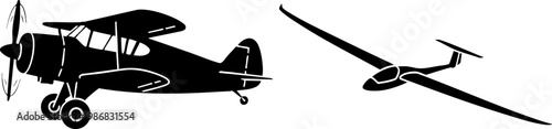 Black Silhouettes of Vintage Biplane and Modern Glider Airplane