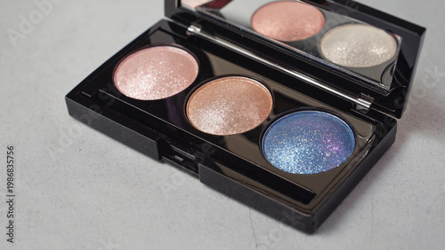 three shades highlighter compact makeup closeup view.ai 