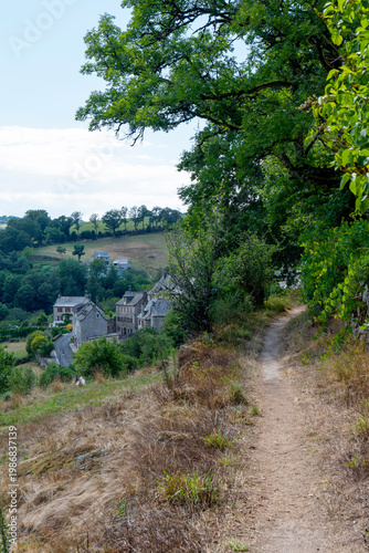 Hiking trail through the rural countryside of Aveyron, France, scenic nature path