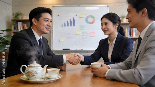 Businessman and businesswoman having a meeting with client in office
