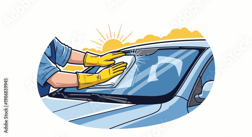 Hands in yellow gloves cleaning a car windshield with a cloth under the sun