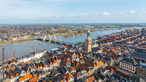 Aerial from historic riverside city Kampen with prominent church along the river IJssel in the Netherlands