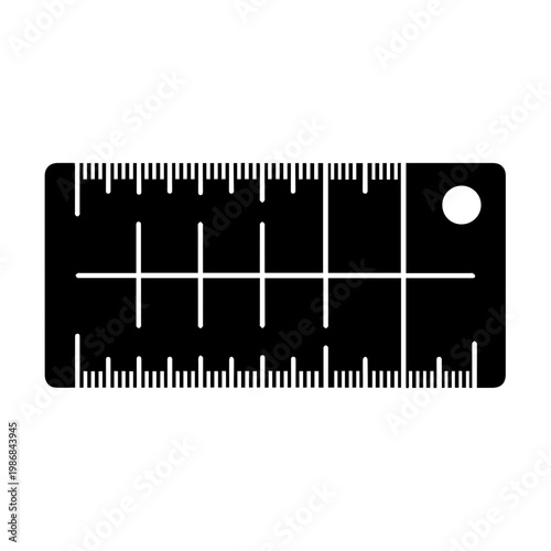 A black ruler with white markings on a white background