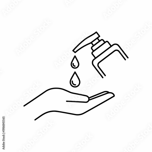 Hand receiving liquid from a dispenser.