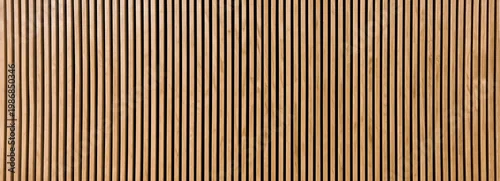 Obraz  z motywem Close-up of a wooden panel with vertical slats in alternating light and dark tones, creating a striped pattern.