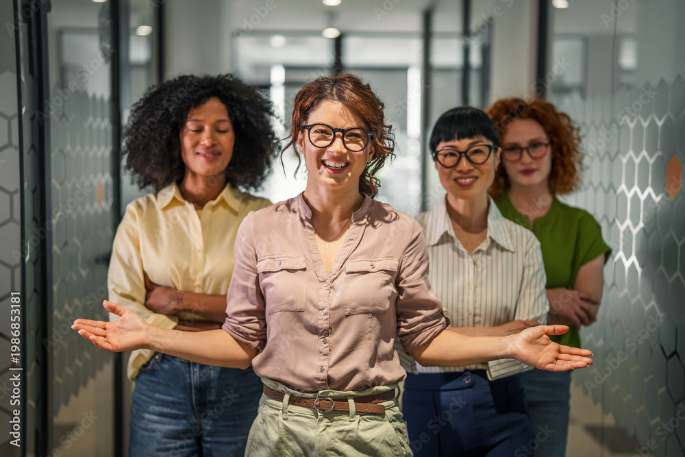 Fototapeta premium Diverse business women team welcoming and smiling in office hallway