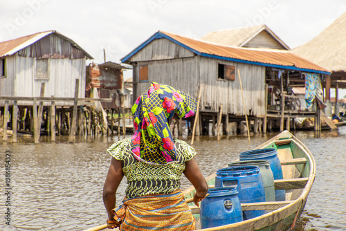 Fishermen in a small boat at lake Nokoué in Benin, West-Africa