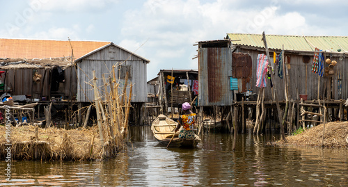 Fishermen in a small boat at lake Nokoué in Benin, West-Africa