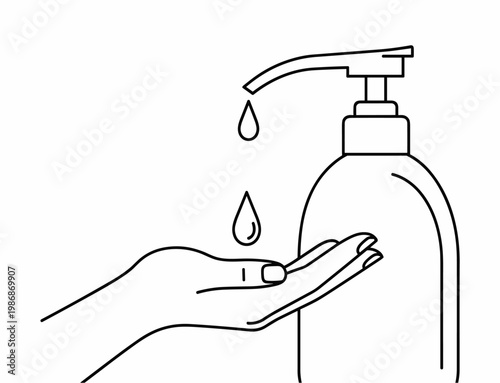 Hand under a soap dispenser.