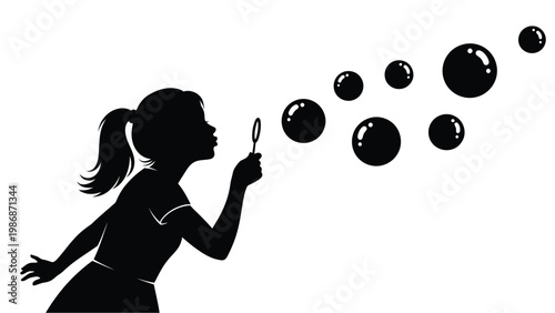 Young girl blowing bubbles a striking black silhouette
