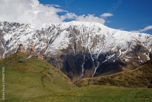 Snow covered mountains under blue sky