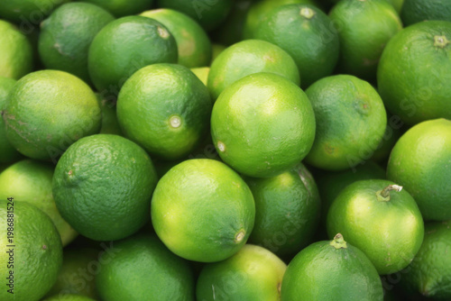 Many fresh limes as background	