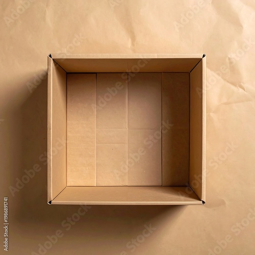 An empty cardboard box on a brown surface