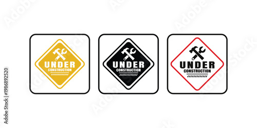 Three different colored under construction signs with hammer and wrench icons displayed in a row