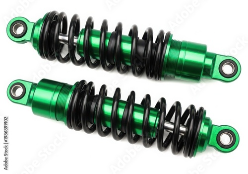 A pair of green and black shock absorbers with coiled springs and metal ends.