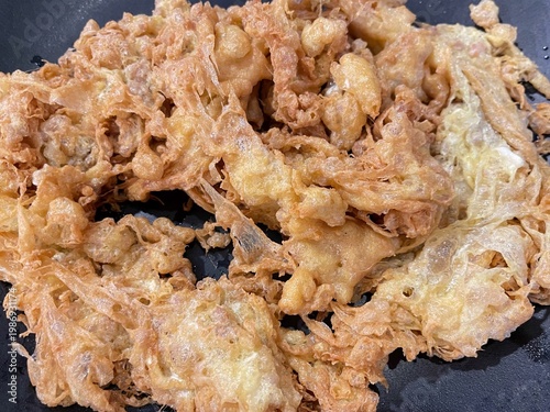 Authentic Thai crispy scrambled egg with minced pork, golden and flavorful with a rich, savory texture.