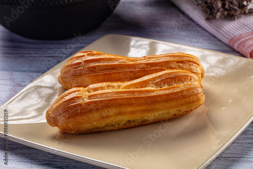 Принти на полотні Sweet baked eclair dessert with cream