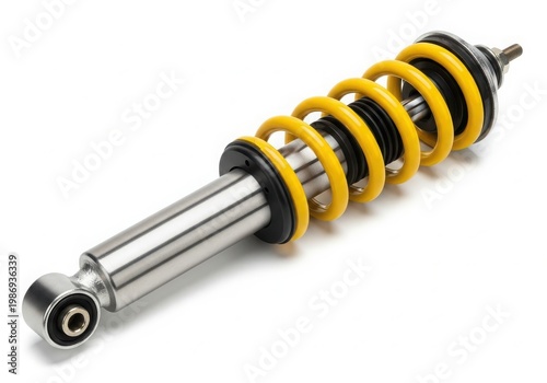 Close-up view of a yellow and black automotive suspension shock absorber